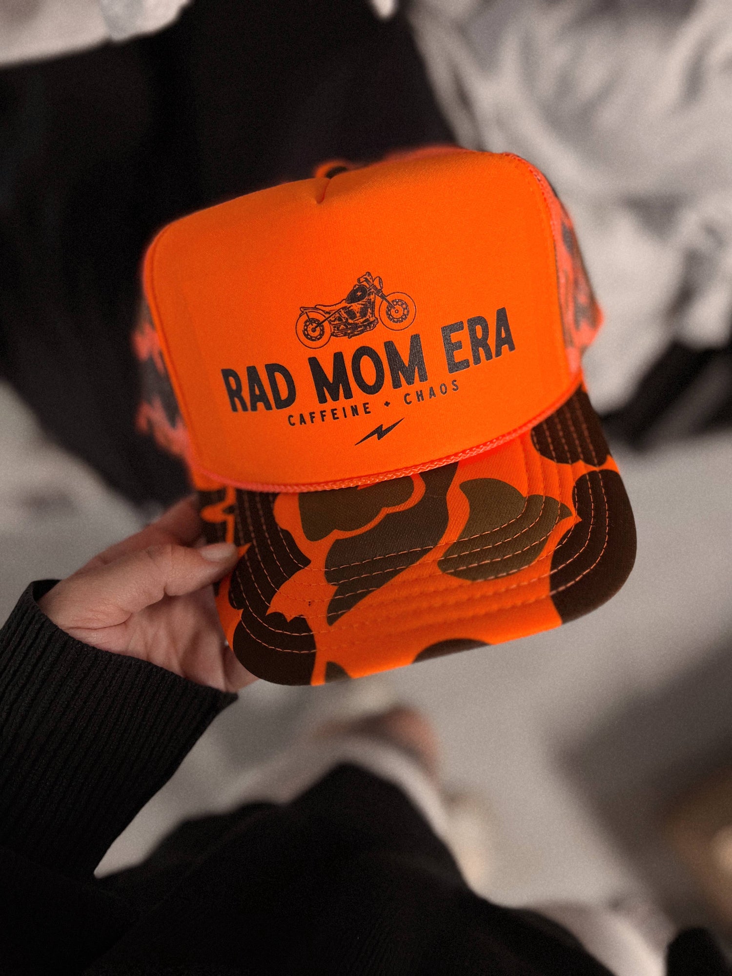 WE THE BABES - Rad Mom Era Trendy Trucker Hat - Neon Orange Camo